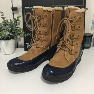 Light brown and blue rubber boots.